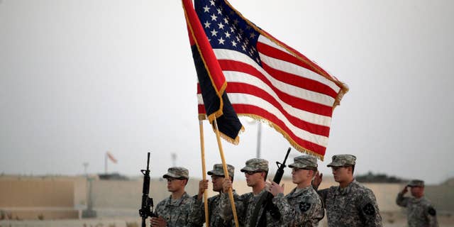 U.S. Army soldiers take part in the casing ceremony on Aug. 21 for the last American combat brigade to serve in Iraq as a small army of American diplomats is left behind to keeping the volatile country from slipping back to the brink of civil war.