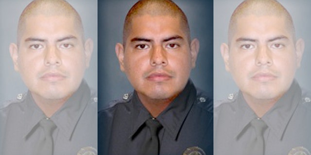 This image provided by the Los Angeles Police Department shows Officer Roberto C. Sanchez, who died Saturday May 3, 2014, at a Los Angeles hospital after the patrol car he was driving was broadsided by an SUV in the Harbor City area. The squad car was so mangled that Sanchez's partner had to call for help on his personal cellphone because the police radio wasn't working. (AP Photo/LAPD)