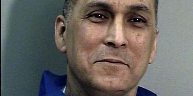 This undated file photo from the California Department of Corrections and Rehabilitation shows Rene "Boxer" Enriquez. The Los Angeles Police Department used an invalid court order and spent $22,000 to bring the imprisoned killer and former gang leader to speak to an exclusive dinner for private executives, according to a report released Friday.