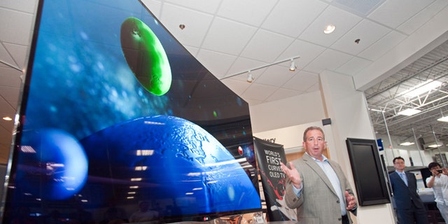 July 22, 2013: Tim Alessi, director of new product development LG Electronics USA, announces the first U.S. availability of LG's OLED HDTV on sale beginning today at the Magnolia Design Center in Best Buy.