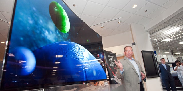 July 22, 2013: Tim Alessi, director of new product development LG Electronics USA, announces the first U.S. availability of LG's OLED HDTV on sale beginning today at the Magnolia Design Center in Best Buy.