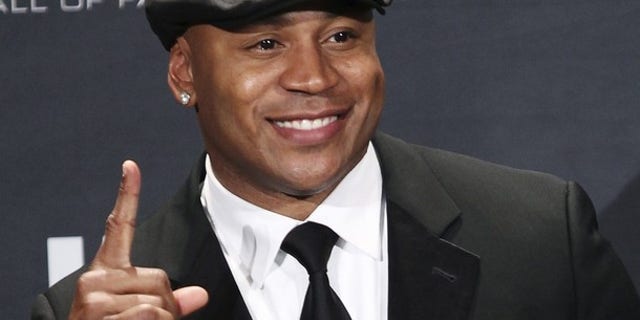 Rapper and television actor LL Cool J poses backstage after introducing the Beastie Boys at the Rock n' Roll Hall of Fame in Cleveland, Ohio in this April 14, 2012 file photo.