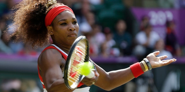 Aug. 4, 2012: United States' Serena Williams returns a shot to Maria Sharapova of Russia in the women's singles gold medal match at the All England Lawn Tennis Club at Wimbledon, in London, at the 2012 Summer Olympic.