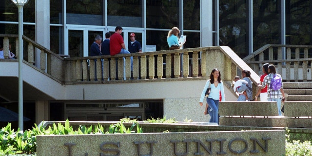 Students walk outside at Louisiana State University in Baton Rouge, Louisiana.