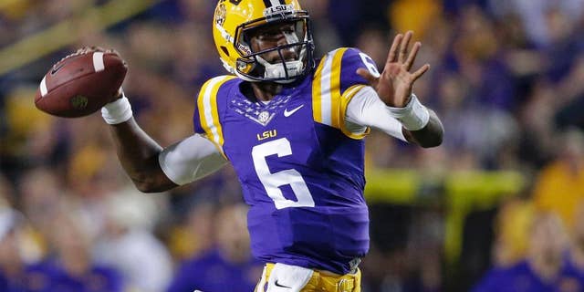FILE - In this Saturday, Sept. 27, 2014, file photo, LSU quarterback Brandon Harris (6) throws a touchdown pass to wide receiver Malachi Dupre, not pictured, during the first half of an NCAA college football game against New Mexico State in Baton Rouge, La. LSU coach Les Miles announced Monday, Sept. 29, 2014, that true freshman will start at quarterback against Auburn on Saturday. (AP Photo/Gerald Herbert, File)