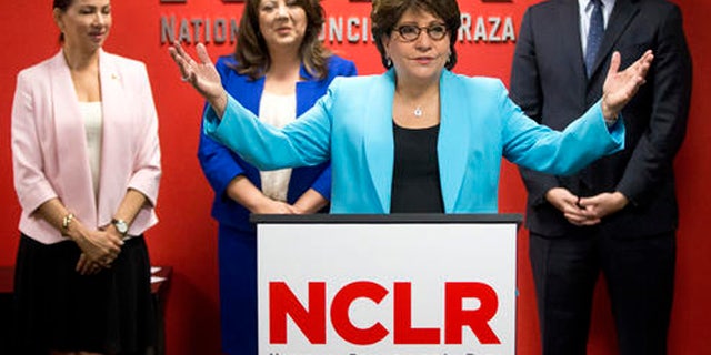 Janet Murguia, center, president of the National Council of La Raza (NCLR) speaks during a news conference, Thursday, April 7, 2016, in Miami. The NCLR, the nation's largest Hispanic civil rights organization, has launched a major voter-registration drive in the battleground state of Florida to identify and sign up hundreds of thousands of potential Hispanic voters. At rear from left are: Maria Garza, president of the Mexican American Council, Doral, Fla., city councilwoman Sandra Ruiz, and Miami Republican state Rep. Jose Felix Diaz. (AP Photo/Wilfredo Lee)