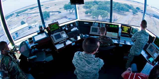 FILE: Air traffic controllers from the 37th Operations Support Squadron prepare to navigate F-16 Falcons down the runway on Lackland Air Force Base.