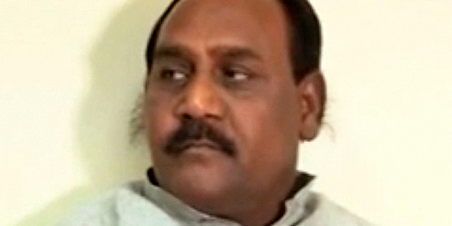 Indian police are looking for the country's so-called "happiness minister," who is wanted in connection with a 2009 murder.