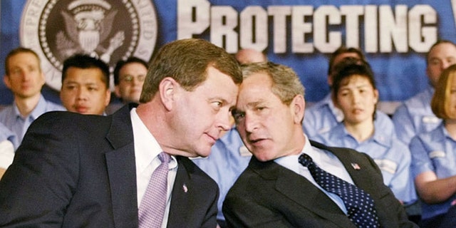 FILE: Undated: Rep. Tom Latham, R-Iowa, talks with then-President George W. Bush, DesMoines, Iowa.