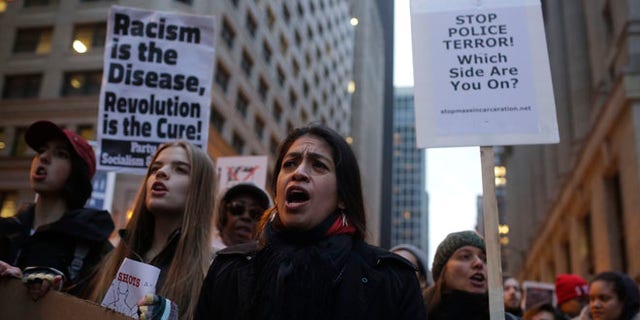 CHICAGO, IL - DECEMBER 18 : Demonstrators continue to protest the fatal police shooting of Laquan McDonald December 18, 2015 in Chicago, Illinois. Former Chicago police officer Jason Van Dyke, who was charged with murder last month in the shooting death of 17-year-old McDonald last year, was indicted on six counts of first-degree murder and one count of official misconduct earlier this week. (Photo by Joshua Lott/Getty Images)
