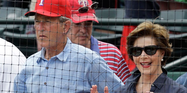April 24: Former president George W. Bush and Laura take in an afternoon baseball game between the Texas Rangers and the Kansas City Royals