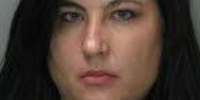 This photo provided by the Sacramento Police Dept. shows Laurie Ann Martinez. Martinez has been charged with faking her own rape in an unsuccessful bid to persuade her husband to move to a safer neighborhood in Sacramento, Calif.