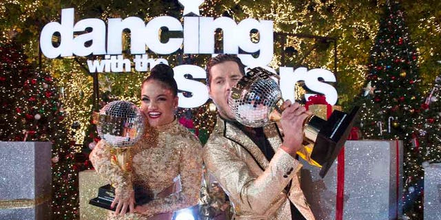 Laurie Hernandez and Val Chmerkovskiy celebrate after winning the 23rd season of 'Dancing With The Stars.'