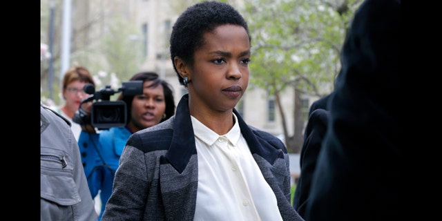 This April 22, 2013 file photo shows singer Lauryn Hill walking from federal court in Newark, N.J. Hill faced sentencing Monday, May 6, on federal tax charges. Hill pleaded guilty last year to not paying federal taxes on $1.8 million earned from 2005 to 2007. A judge two weeks ago said Hill had paid only about $50,000 of more than $500,000 she owes.