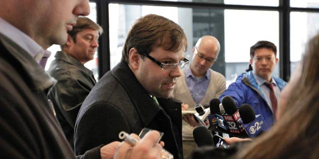 FILE - In this Dec. 21, 2012 file photo, attorney Beau Brindley, center, speaks with reporters at the federal courthouse in Chicago. Closing arguments were planned for Thursday, Aug. 27, in the federal bench trial of Brindley, who is facing obstruction-of-justice charges. (AP Photo/Teresa Crawford, File)