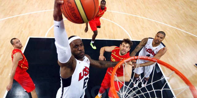 FILE - In this Aug. 12, 2012, file photo, United States' LeBron James (6) dunks against Spain during the men's gold medal basketball game at the 2012 Summer Olympics in London. James said Monday, Sept. 29, 2014, following the Cavaliers' practice that he's "nowhere near" deciding if he'll again play for Team USA in two years for the 2016 Olympics. (AP Photo/Christian Petersen, Pool, File)