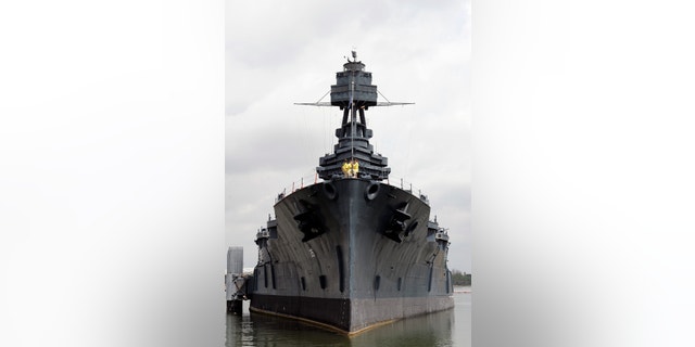 June 13, 2012: Tourists visit the deck of the USS Texas as she lists slightly on the port side in Houston.