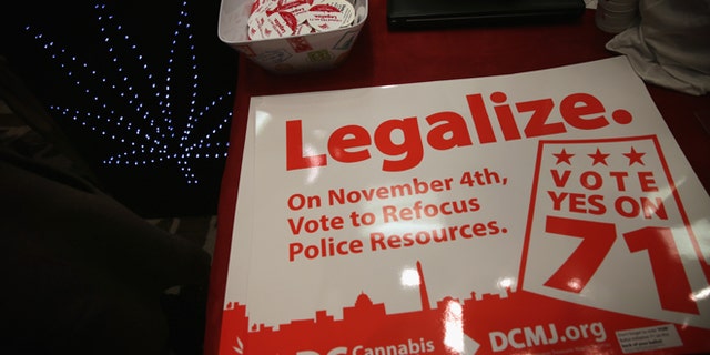 WASHINGTON, DC - FEBRUARY 28: Posters and stickers regarding Washington, DC's marijuana legalization are seen during a ComfyTree Cannabis Academy conference February 28, 2015 in Washington, DC. Attendees participated in the conference to gain knowledge on how to legally enter and operate in the cannabis industry. (Photo by Alex Wong/Getty Images)