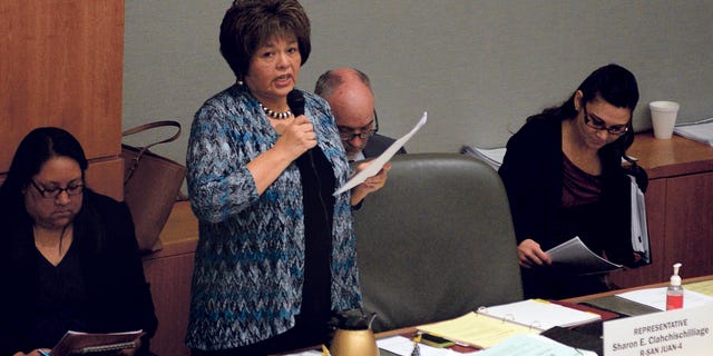 FILE - In this March 19, 2015 file photo, Rep. Sharon Clahchischilliage, R-Kirtland, speaks on the floor of the New Mexico house in Santa Fe, N.M. Officials said this week Rep. Alonzo Baldonado, of Los Lunas, and Clahchischilliage will join the Republican State Leadership Committee's "Future Majority Project." (Clyde Mueller/Santa Fe New Mexican via AP)