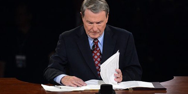 Oct. 3, 2012: Moderator Jim Lehrer looks over his notes before the first presidential debate at the University of Denver, in Denver.