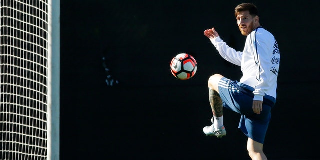 Argentina midfielder Lionel Messi kicks the ball during practice, Monday, June 13, 2016, in Tukwila, Wash. Argentina is scheduled to face Bolivia on Tuesday in a Copa America Centenario soccer match in Seattle. (AP Photo/Ted S. Warren)