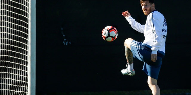 Argentina midfielder Lionel Messi kicks the ball during practice, Monday, June 13, 2016, in Tukwila, Wash. Argentina is scheduled to face Bolivia on Tuesday in a Copa America Centenario soccer match in Seattle. (AP Photo/Ted S. Warren)