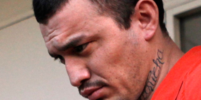In this April 22, 2009 file photo, Ingmar Guandique, 27, is escorted from the Violent Crimes Unit by police in Washington. (AP)
