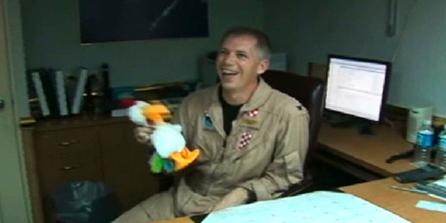 In this frame grab taken from video obtained by the Virginian-Pilot newspaper, U.S. Navy Capt. Owen Honors appears in one of a series of profanity-laced comedy sketches that were broadcast on the USS Enterprise via closed-circuit television.