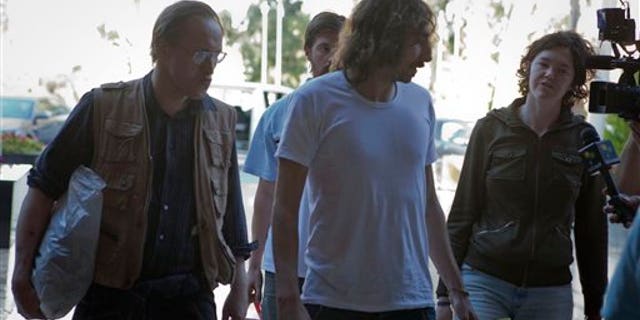 May 18: Freed American freelance journalist Clare Morgana Gillis, Spanish photographer Manu Brabo and British Nigel Chandler arrive at a hotel where most of the international media stays in Tripoli, Libya.