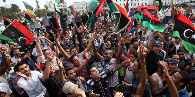 Libyan residents celebrate in Tripoli, Libya.