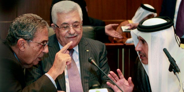 Oct. 8, 2010: Palestinian President Mahmoud Abbas, center, listens to Qatar's Foreign Minister Sheik Hamad Bin Jassem, right and Amr Moussa, Secretary general of the Arab League, during the Arab Foreign Ministers Peace Initiative meeting, in Sirte, Libya.