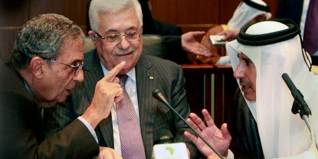 Oct. 8, 2010: Palestinian President Mahmoud Abbas, center, listens to Qatar's Foreign Minister Sheik Hamad Bin Jassem, right and Amr Moussa, Secretary general of the Arab League, during the Arab Foreign Ministers Peace Initiative meeting, in Sirte, Libya.