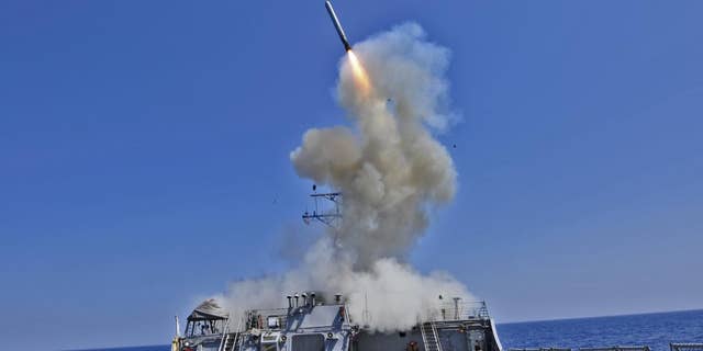 File - In a March 29, 2011 photo provided by the U.S. Navy, the guided-missile destroyer USS Barry launches a Tomahawk cruise missile from their location in the Mediterraiean Sea to support U.S. military forces assisting the international response to the unrest in Libya. (AP Photo/U.S. Navy, MC3 Jonathan Sunderman)