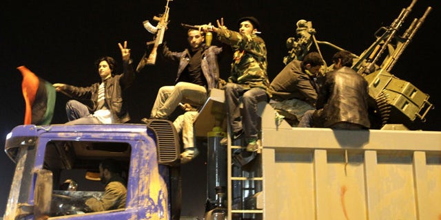 Libyan rebels in Benghazi on March 17. Libya is ready for a ceasefire with the rebels battling Muammar Qaddafi, but wants to discuss in advance how it would be implemented, deputy foreign minister Khaled Kaaim said in Tripoli (AFP).