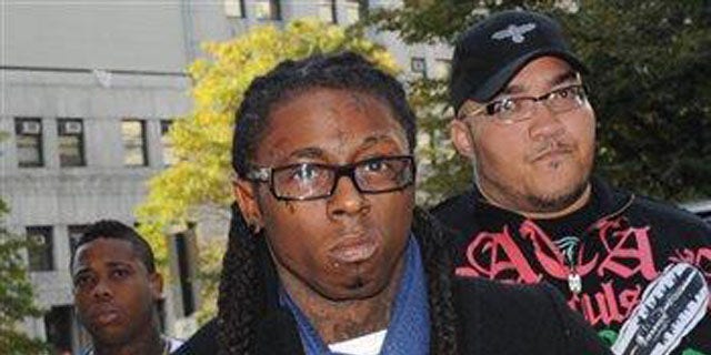 Oct. 21, 2009: Rapper Lil Wayne enters Manhattan criminal court in New York.