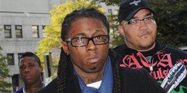 Oct. 21, 2009: Rapper Lil Wayne enters Manhattan criminal court in New York.