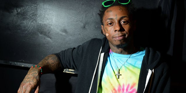 Feb. 1, 2013: In this file photo, recording artist Lil Wayne meets fans and celebrates his contemporary street wear apparel brand TRUKFIT at his hometown Macy's, in New Orleans.