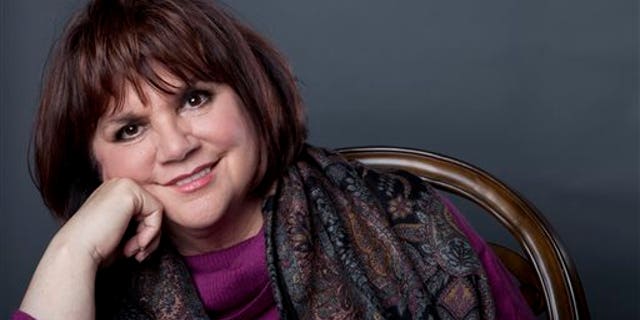 FILE - In this Sept. 17, 2013 file photo, American musician Linda Ronstadt poses in New York to promote the release of her memoir "Simple Dreams." Ronstadt will be inducted into the 2014 Rock and Roll Hall of Fame on April 10 at the Barclays Center in New York. (Photo by Amy Sussman/Invision/AP, File)