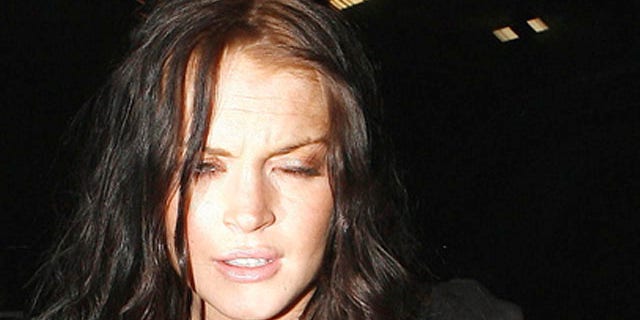 April 7: Lindsay Lohan heads to an after party at the Roosevelt Hotel.