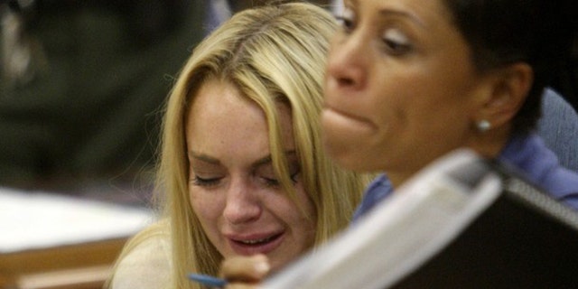 July 6: Lindsay Lohan cries in a Beverly Hills Court House after being sentenced to 90 days in jail.