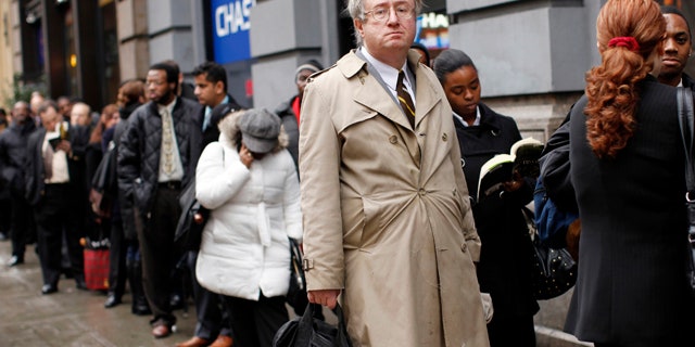 FILE: Eric Lipps, 52, waits in line to enter the NYCHires Job Fair on Dec. 9, 2009, in New York City.