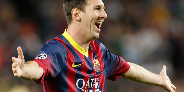 Barcelona's Lionel Messi celebrates scoring 1-0 during the Champions League group H soccer match between Ajax Amsterdam and F.C. Barcelona on Wednesday, Sept. 18, 2013, at Camp Nou stadium in Barcelona, Spain. (AP Photo/Emilio Morenatti)