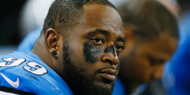 FILE - In this Oct. 19, 2014, file photo, Detroit Lions defensive tackle C.J. Mosley sits on the bench during the second half of an NFL football game against the New Orleans Saints in Detroit. Mosley was sent home from the team’s trip to London and suspended for Detroit’s game against Atlanta on Oct. 26 for an unspecified violation of team rules. The Lions have activated him off the reserve-suspended by club list, and he made a statement Monday, Nov. 3, 2014. (AP Photo/Rick Osentoski, File)