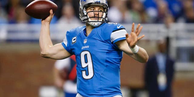 FILE - In this Dec. 22, 2013 file photo, Detroit Lions quarterback Matthew Stafford (9) passes during the second quarter of an NFL football game against the New York Giants in Detroit. With a new coaching staff and a new system to learn, Stafford enters the 2014 season under quite a bit of pressure. (AP Photo/Rick Osentoski, File)
