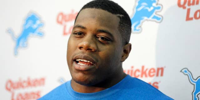 FILE - In this May 16, 2014 file photo, Detroit Lions defensive tackle Caraun Reid is interviewed by the media during the Lions rookie camp in Allen Park, Mich. Reid is named after the doctor who delivered him. He doesn't wear glasses during games because he's more aggressive without them. He also comes with a Princeton pedigree. The Lions are hoping this fifth-round pick can become a solid contributor on the defensive line. (AP Photo/Carlos Osorio, File)