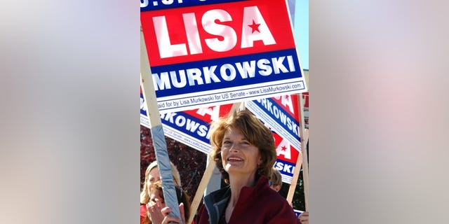 U.S. Sen. Lisa Murkowski, R-Alaska, right, joins volunteers to wave to motorists on Monday, Aug. 23, 2010, in Anchorage, Alaska. Candidates are pulling no punches in their last minute push for voters in Tuesday's primary. The greatest proof of this is in the U.S. Senate race where Sarah Palin has re emerged months after first endorsing GOP challenger Joe Miller to urge Alaskans to support him and to oust Murkowski. Murkowski's not shying away, running a new radio spot of her own, called "Truth," in which she uses audio from a talk show host's tirade against Miller to show Miller as distorting her record. (AP Photo/Mark Thiessen)