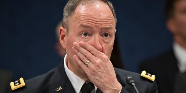 National Security Agency (NSA) Director Gen. Keith B. Alexander testifies on Capitol Hill in Washington, Tuesday, June 18, 2013, before the House Intelligence Committee. Amid revelations that the electronic surveillance agency is sweeping up Americans' phone and Internet records in its quest to investigate terrorist threats, President Barack Obama defended top secret National Security Agency spying programs as legal during an interview yesterday, and called them transparent even though they are authorized in secret. (AP Photo/J. Scott Applewhite)