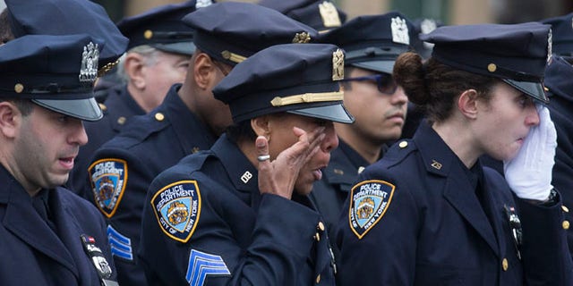 Jan. 4, 2015: Police officers at funeral for New York police Officer Wenjian Liu at Aievoli Funeral Home, Brooklyn, N.Y.