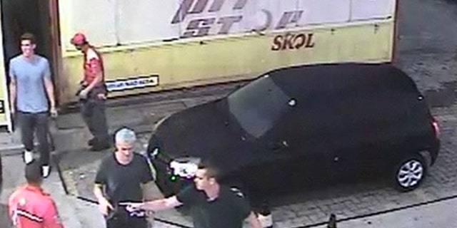 In this Sunday, Aug. 14, 2016 frame from surveillance video released by Brazil Police, swimmer Ryan Lochte, second from right, of the United States, and teammates, appear at a gas station during the 2016 Summer Olympics in Rio de Janeiro, Brazil. A top Brazil police official said the swimmers damaged property at the gas station. (Brazil Police via AP)