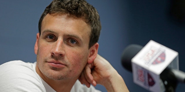 FILE - In this May 12, 2016, file photo, Ryan Lochte listens to a question from the media in Charlotte, N.C. Missy Franklin and Ryan Lochte will be busy in the pool at the Rio Olympics. Just not as busy as they wanted to be. The two popular stars from the U.S. swimming team four years ago in London have just three individual events between them in Rio, hardly the frenetic schedule they've grown accustomed to over the years. (AP Photo/Chuck Burton, File)